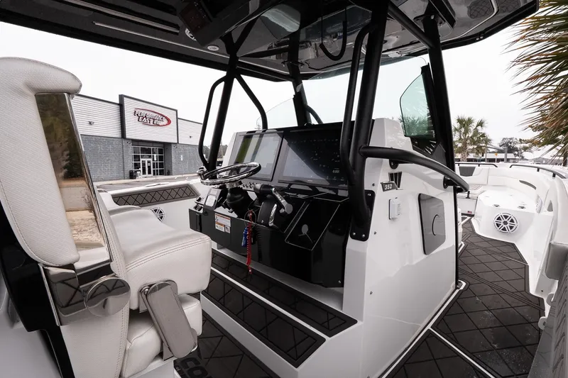 Slide: The Image of 2023 Wellcraft 352 Fisherman boat interior with modern dashboard and seating. - 17