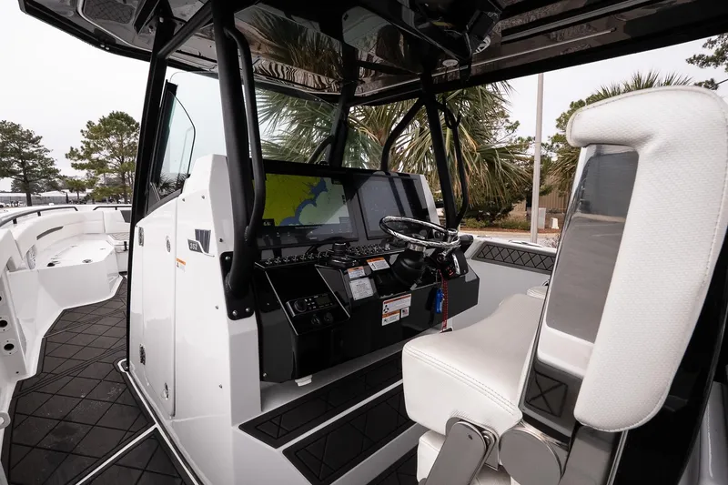 Slide: The Image of 2023 Wellcraft 352 Fisherman boat interior with modern navigation system and seating. - 18