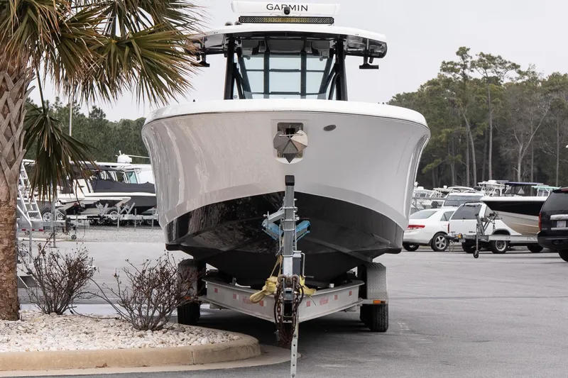 Slide: The Image of 2023 Wellcraft 352 Fisherman boat on trailer in marina parking lot. - 2