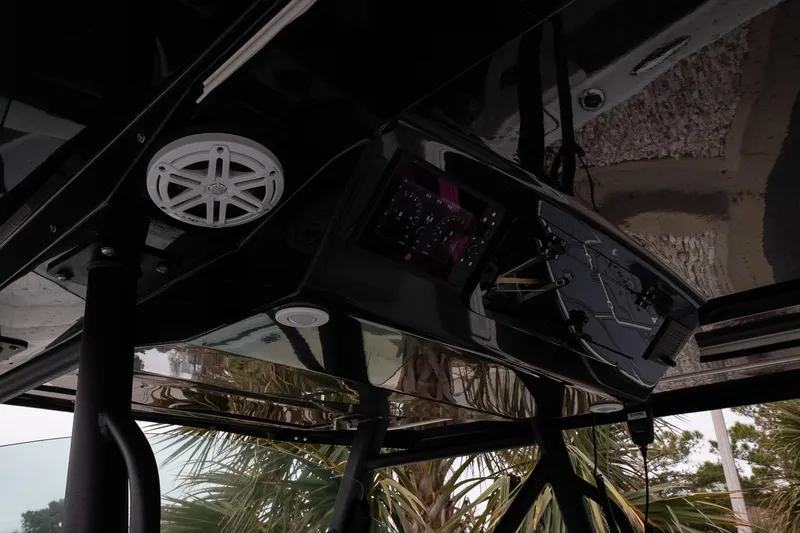 Slide: The Image of 2023 Wellcraft 352 Fisherman boat console with speaker and electronic controls. - 20