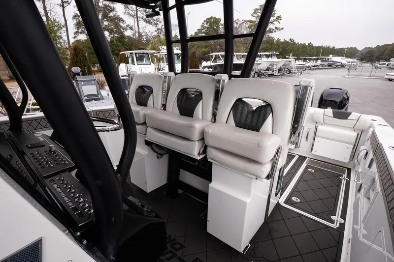 Slide: The Image of 2023 Wellcraft 352 Fisherman boat interior with modern seating and control panel. - 26