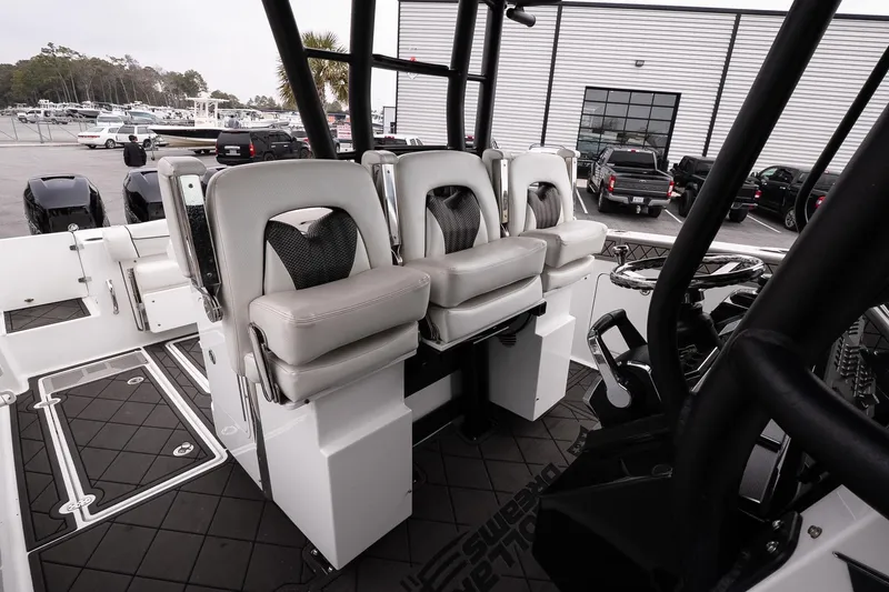Slide: The Image of 2023 Wellcraft 352 Fisherman boat interior with modern seating and steering wheel. - 27
