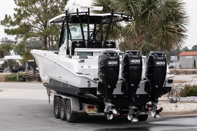 Slide: The Image of 2023 Wellcraft 352 Fisherman boat with four powerful outboard engines on a trailer. - 3