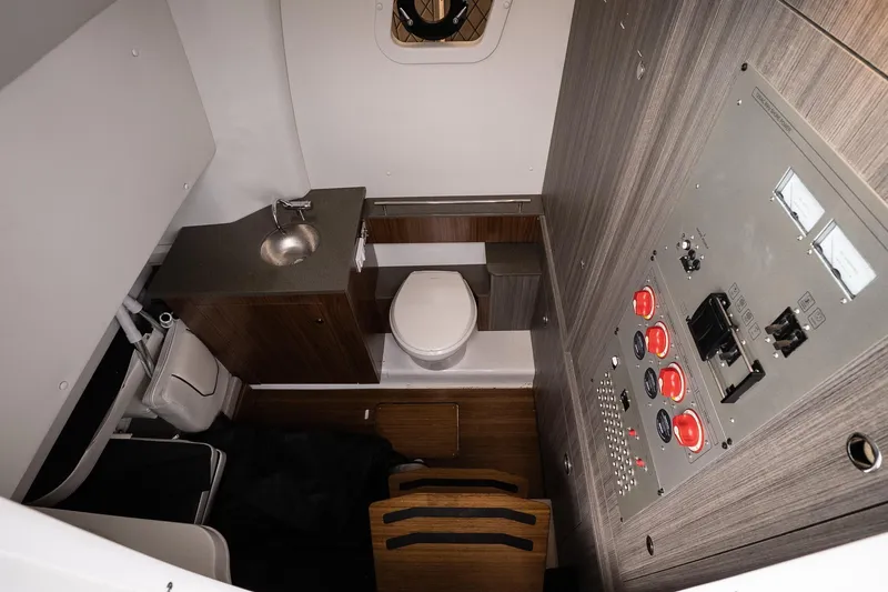 Slide: The Image of 2023 Wellcraft 352 Fisherman cabin with sink, toilet, and control panel. - 33