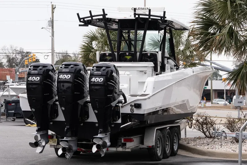 Slide: The Image of 2023 Wellcraft 352 Fisherman boat with triple Mercury 400 engines on a trailer. - 5