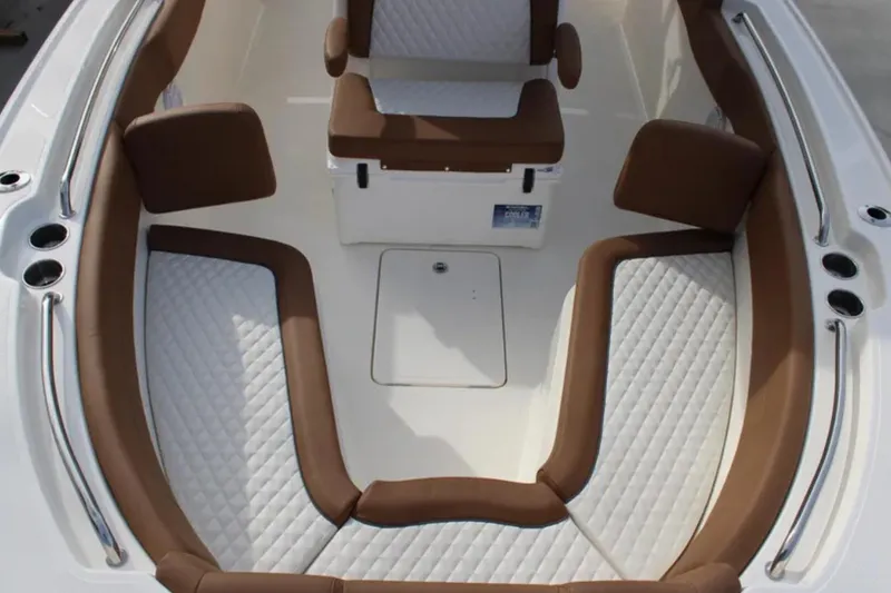 Slide: The Image of 2026 Pioneer 270 Pelagic boat interior with cushioned seating and sleek design. - 13