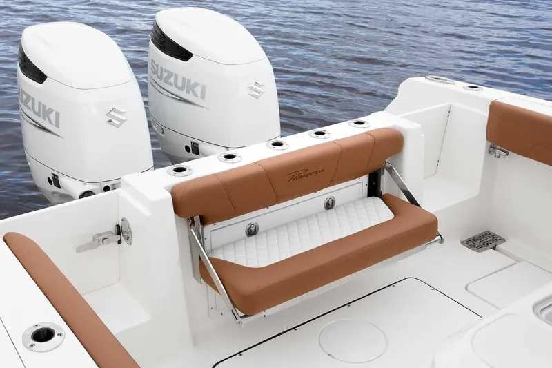 Slide: The Image of Manufacturer Provided Image: 2025 Pioneer 270 Pelagic boat with Suzuki engines, featuring tan seating and rod holders. - 5