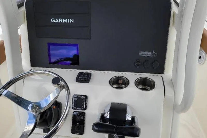 Slide: The Image of Steering console of 2026 Pioneer 270 Pelagic boat with Garmin navigation system. - 6