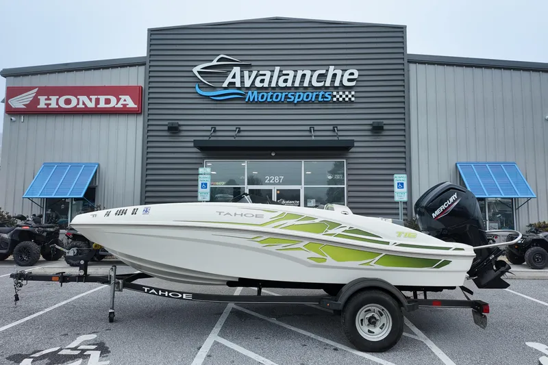The Image of 2021 Tahoe T16 boat on trailer at Avalanche Motorsports dealership. - 0