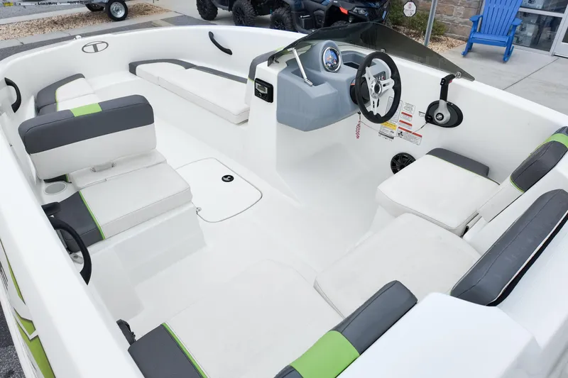 Slide: The Image of Interior of 2021 Tahoe T16 boat with white and gray seating, steering wheel, and dashboard. - 12
