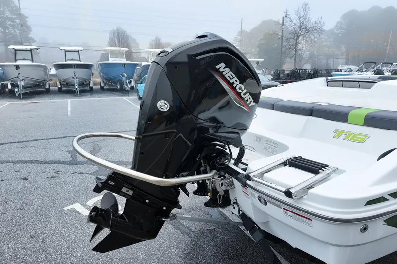 Slide: The Image of 2021 Tahoe T16 boat with Mercury outboard motor in a parking lot. - 7