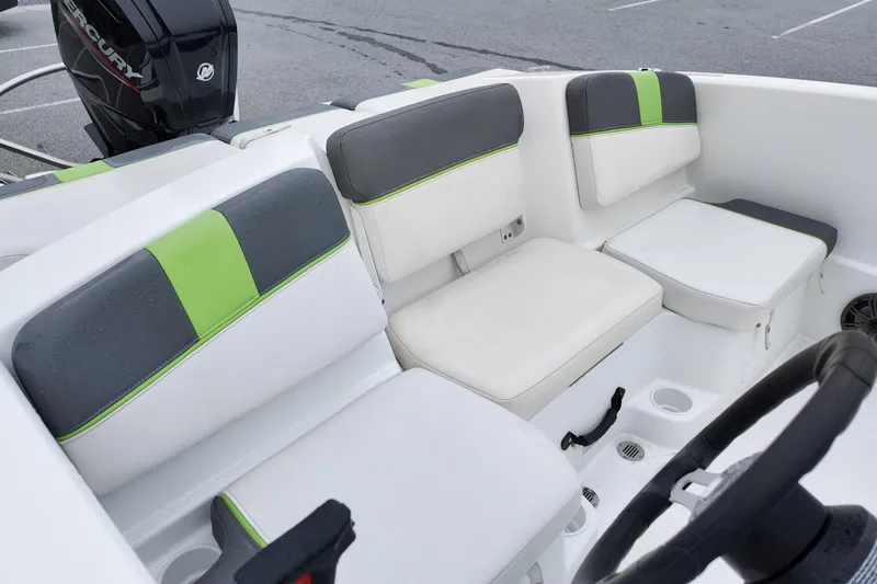 Slide: The Image of 2021 Tahoe T16 boat interior with gray and green cushioned seating. - 9