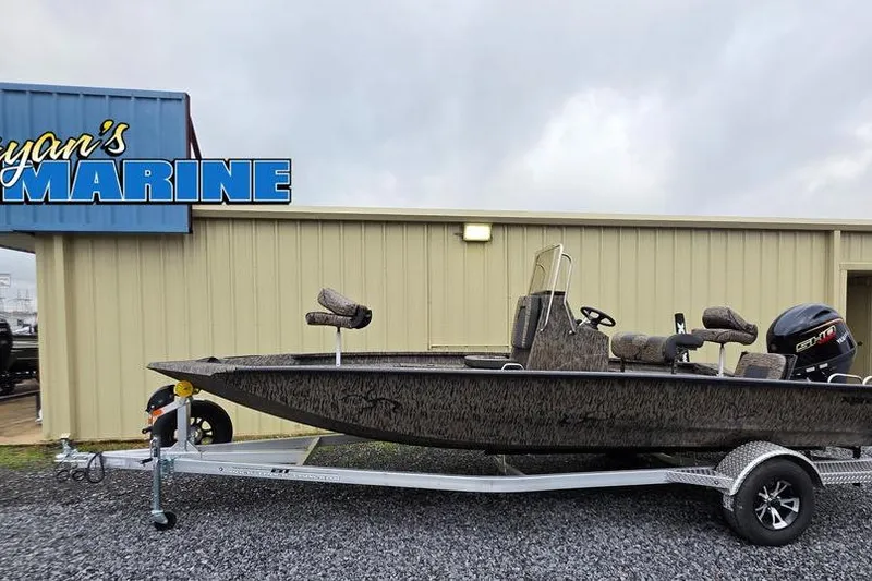 The Image of 2026 Xpress H20B Bay boat on trailer at marine dealership. - 1