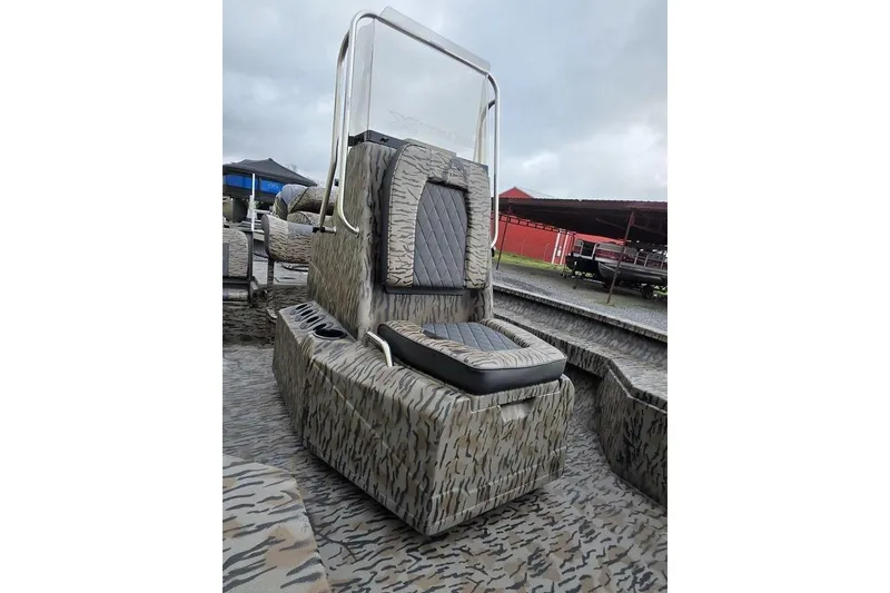 Slide: The Image of 2026 Xpress H20B Bay boat with camouflage seating and console design. - 16