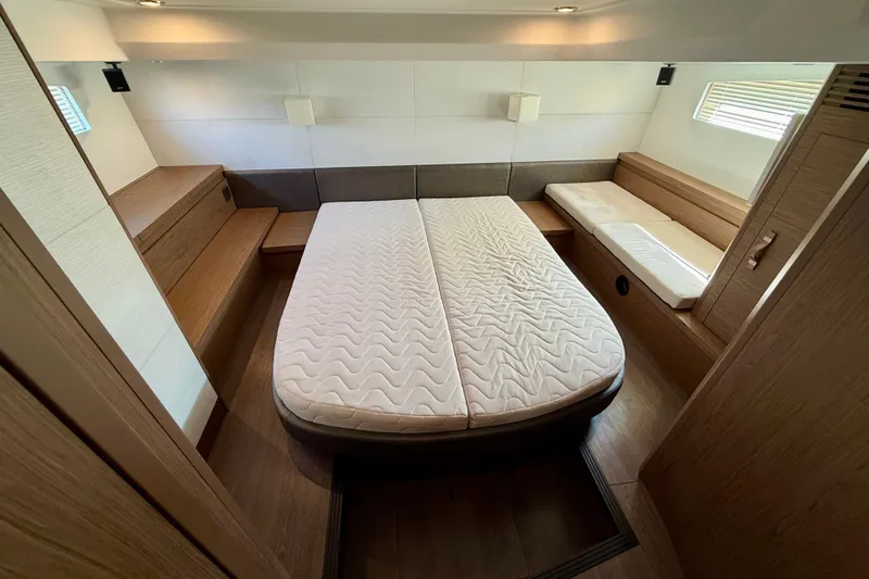 Slide: The Image of Luxurious cabin interior of 2019 Beneteau Gran Turismo 46 yacht, featuring a comfortable bed. - 31