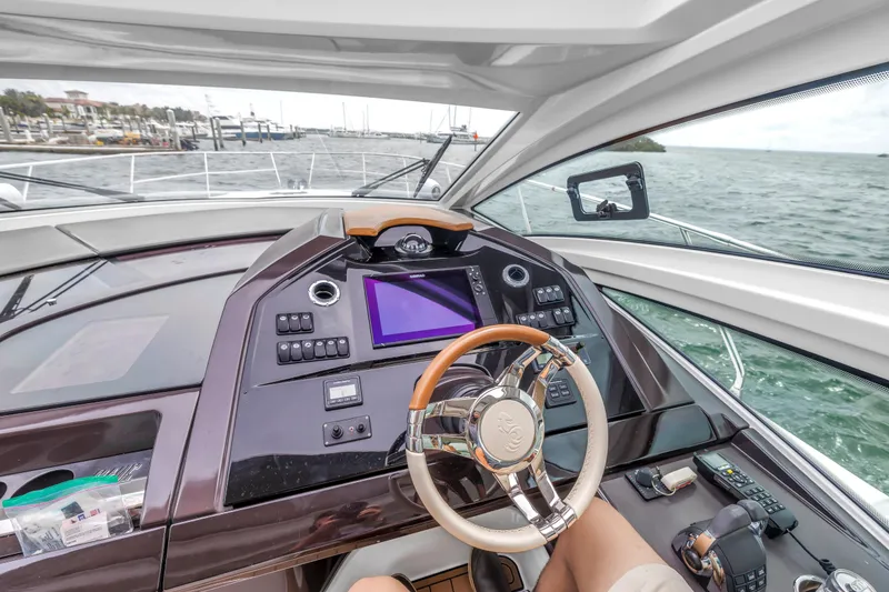 Slide: The Image of Cockpit view of 2019 Beneteau Gran Turismo 46 yacht with modern controls and steering wheel. - 36