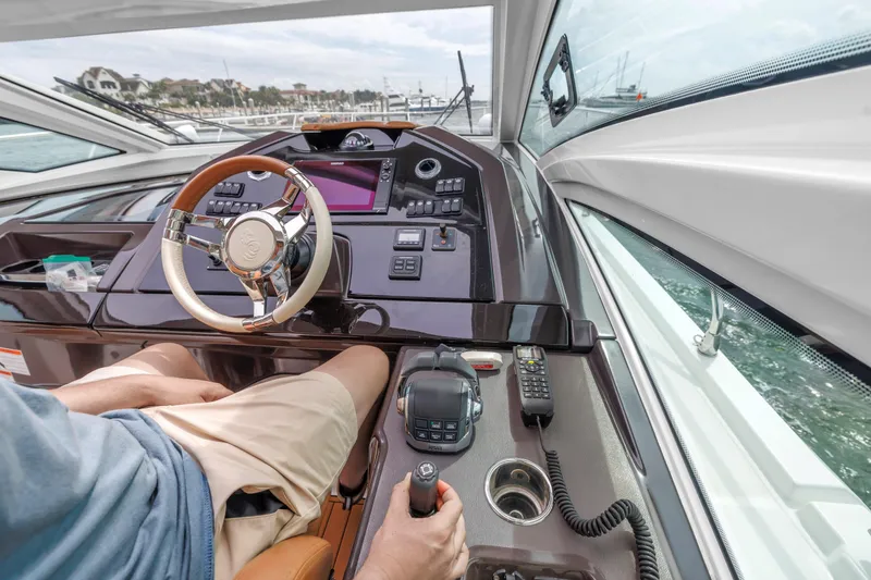Slide: The Image of Cockpit view of 2019 Beneteau Gran Turismo 46 yacht, featuring modern controls and steering. - 38