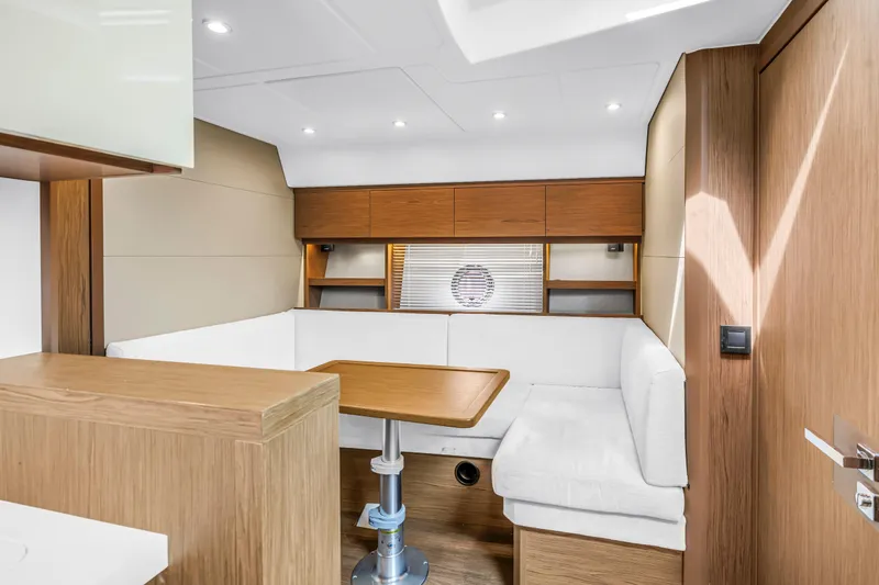 Slide: The Image of Interior of 2019 Beneteau Gran Turismo 46 yacht with modern seating and wooden finishes. - 41