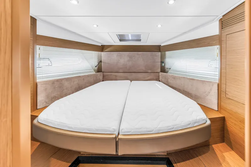 Slide: The Image of Luxurious cabin interior of 2019 Beneteau Gran Turismo 46 yacht with comfortable bedding. - 46
