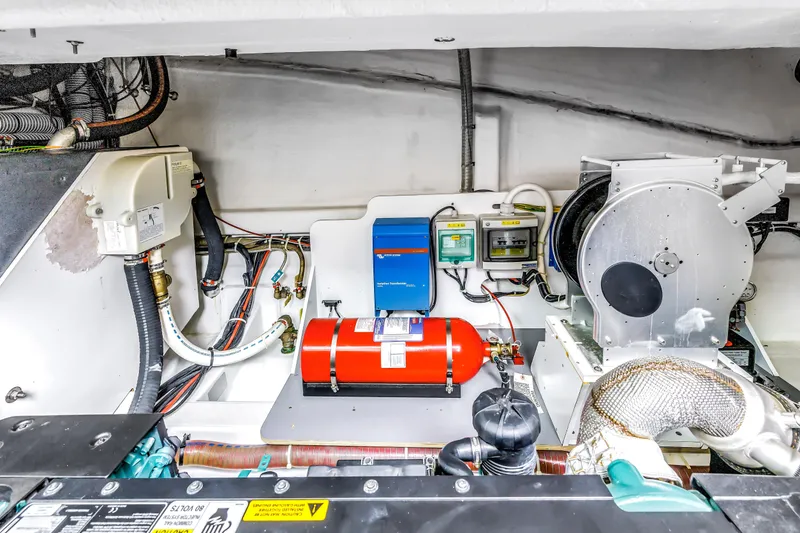 Slide: The Image of Engine room of 2019 Beneteau Gran Turismo 46 yacht, featuring mechanical and electrical components. - 63