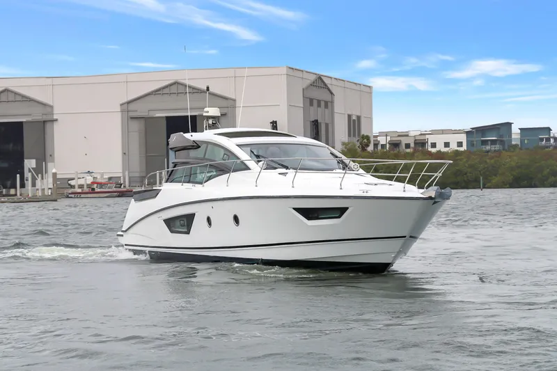 Slide: The Image of 2019 Beneteau Gran Turismo 46 yacht cruising near industrial buildings. - 70