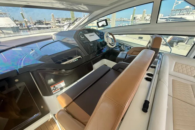 Slide: The Image of 2019 Beneteau Gran Turismo 46 yacht interior with modern helm and luxurious seating. - 9