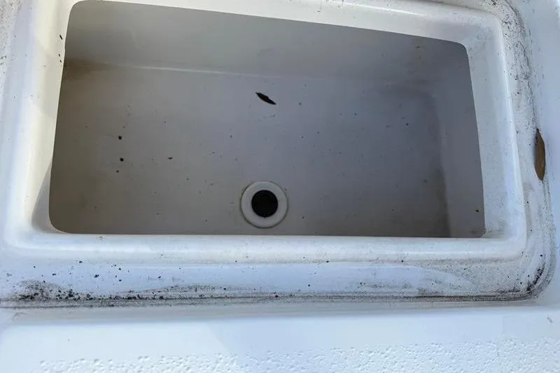 Slide: The Image of Livewell compartment of a 2007 Sea Pro SV1900CC Bay Boat, showing interior details. - 12