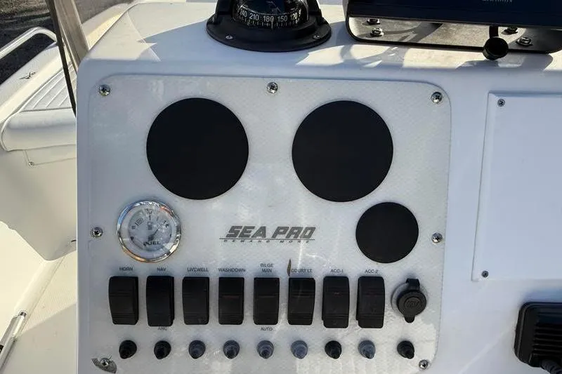 Slide: The Image of 2007 Sea Pro SV1900CC Bay Boat dashboard with controls and compass. - 16