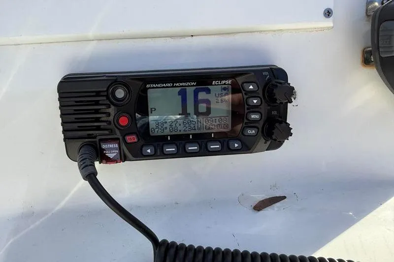 Slide: The Image of VHF radio on 2007 Sea Pro SV1900CC Bay Boat, displaying channel 16. - 17