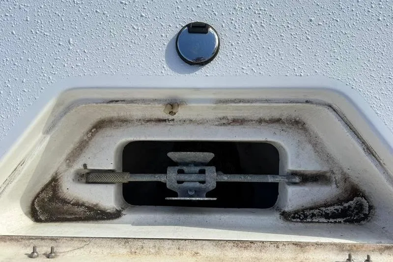 Slide: The Image of 2007 Sea Pro SV1900CC Bay Boat anchor storage compartment, showing metal anchor holder. - 23