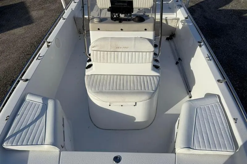 Slide: The Image of 2007 Sea Pro SV1900CC Bay Boat interior with white seating and console. - 24