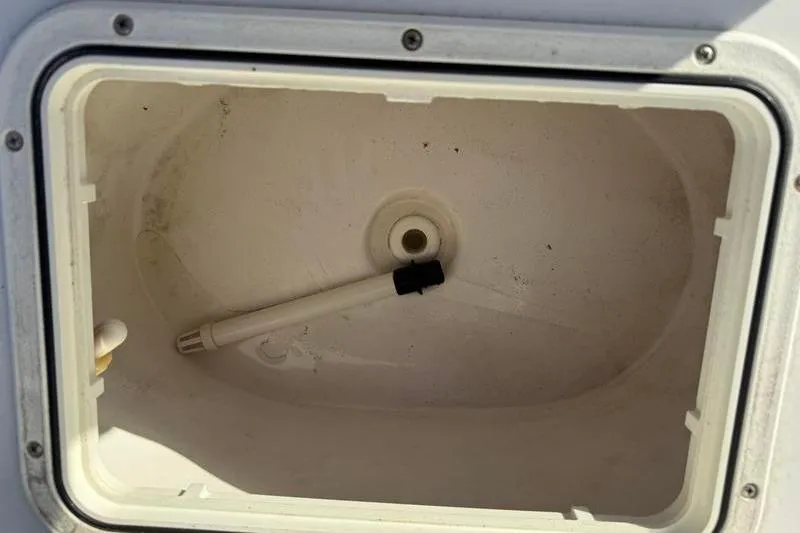 Slide: The Image of Livewell compartment of 2007 Sea Pro SV1900CC Bay Boat, featuring a drain and pipe. - 25
