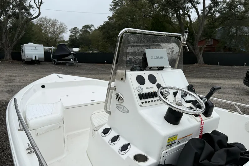 Slide: The Image of 2007 Sea Pro SV1900CC Bay Boat with Garmin navigation system in a parking area. - 5