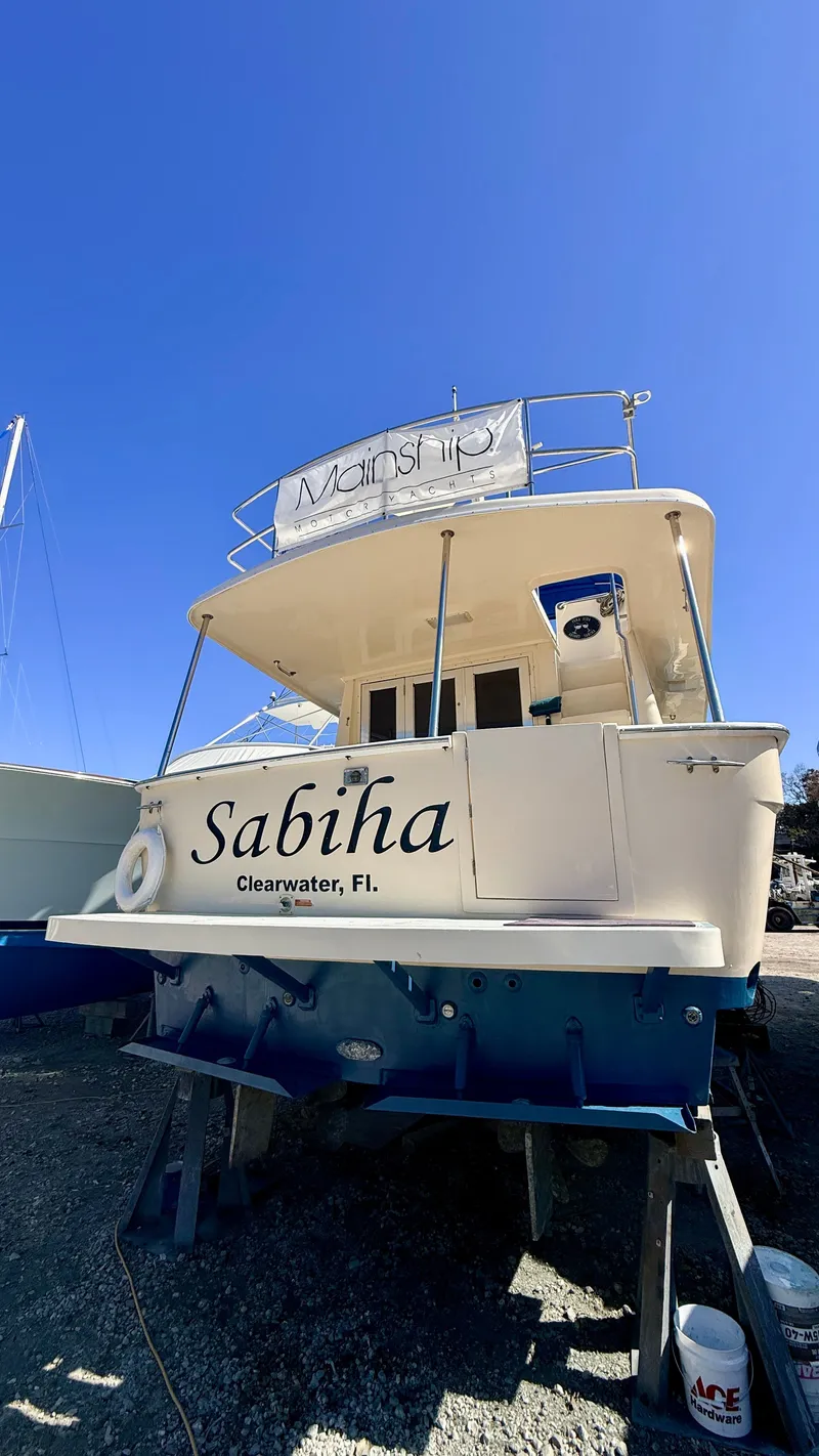 Slide: The Image of 2004 Mainship 400 Trawler in Clearwater, Florida, on stands. - 1