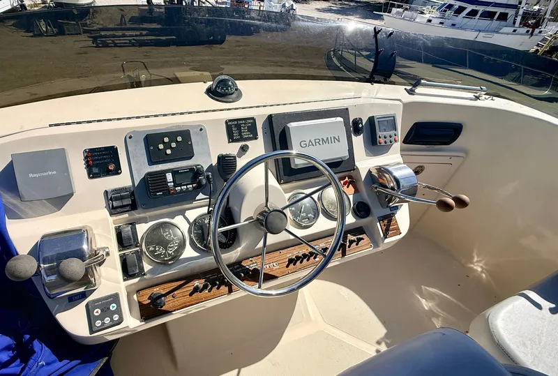 Slide: The Image of Helm of a 2004 Mainship 400 Trawler with Garmin navigation. - 11