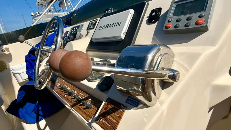 Slide: The Image of 2004 Mainship 400 Trawler helm with Garmin device. - 12