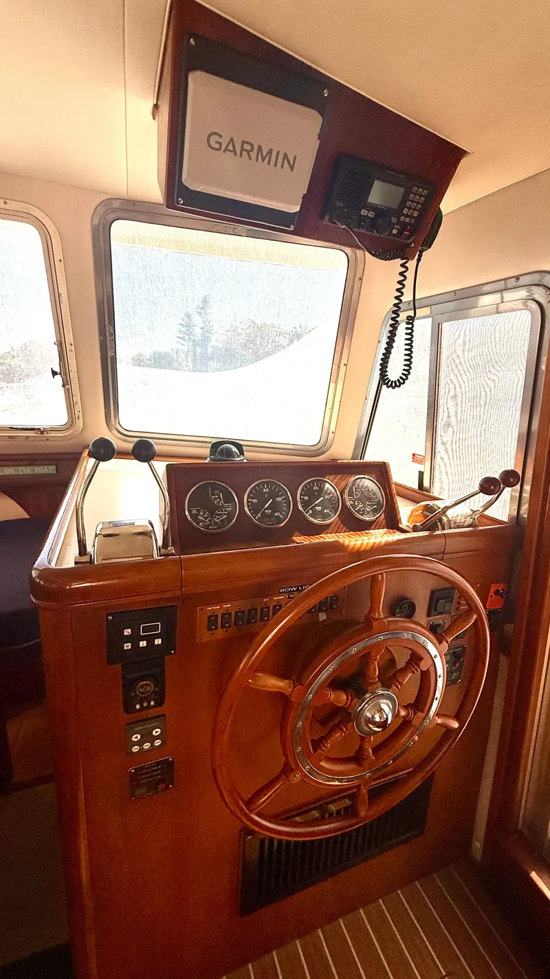 Slide: The Image of 2004 Mainship 400 Trawler helm with Garmin equipment. - 20