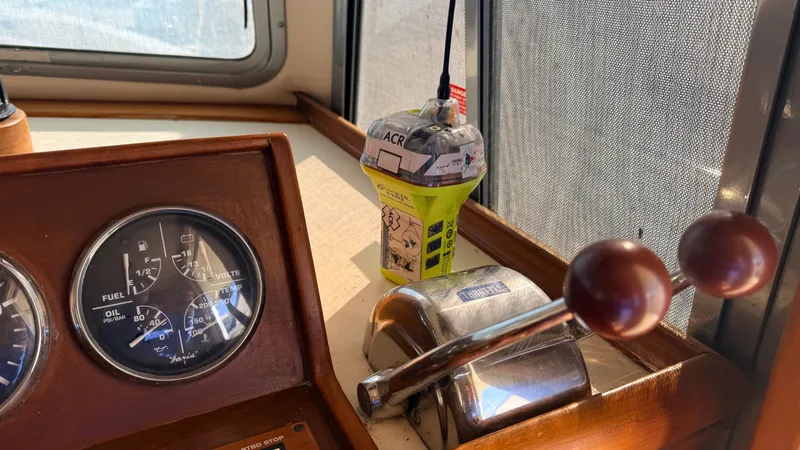 Slide: The Image of 2004 Mainship 400 Trawler helm with gauges and controls. - 5