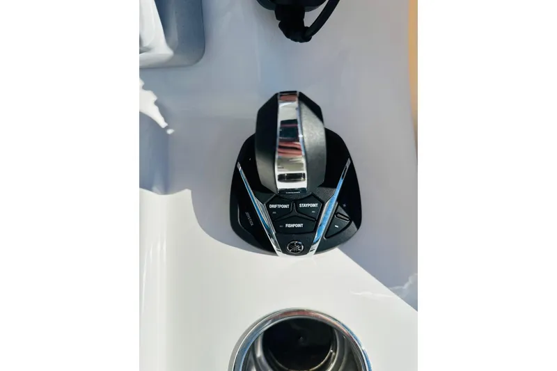 Slide: The Image of 2025 Contender 35 ST boat dashboard with Garmin navigation displays and controls. - 4