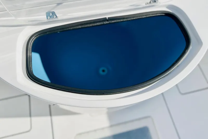 Slide: The Image of 2025 Contender 35 ST boat seat with white upholstery and armrests. - 7