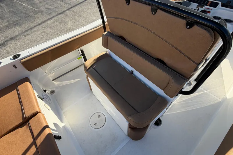 Slide: The Image of 2020 Sea Hunt Ultra 235 SE boat dashboard with steering wheel and navigation display. - 13