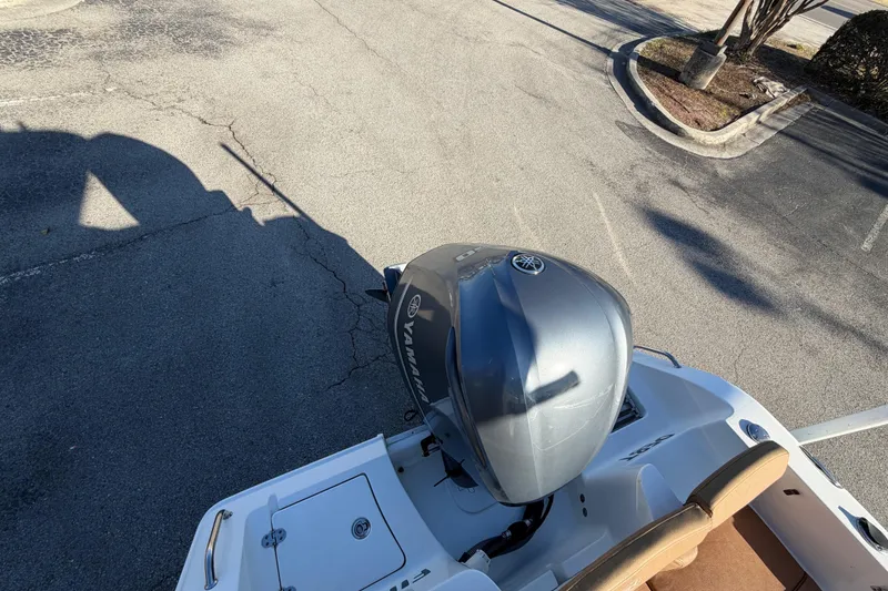 Slide: The Image of Interior view of 2020 Sea Hunt Ultra 235 SE boat console with ocean backdrop. - 15