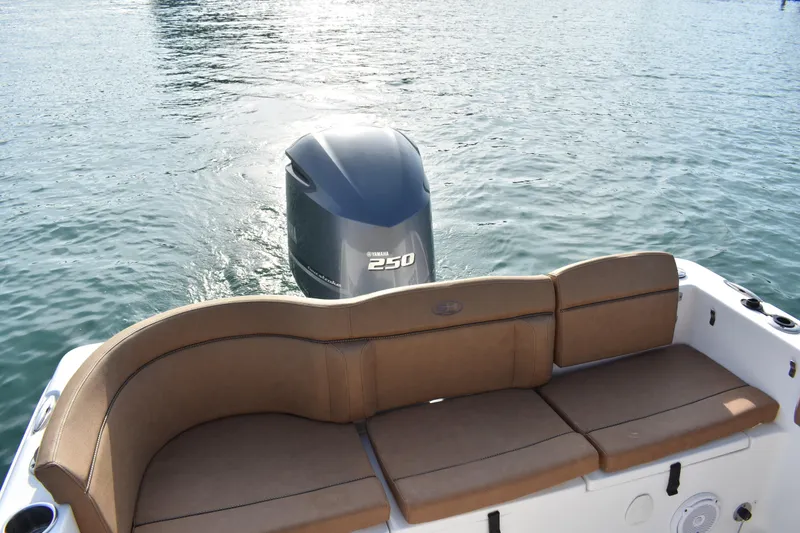 Slide: The Image of 2020 Sea Hunt Ultra 235 SE boat with Yamaha 250 engine and tan seating. - 20