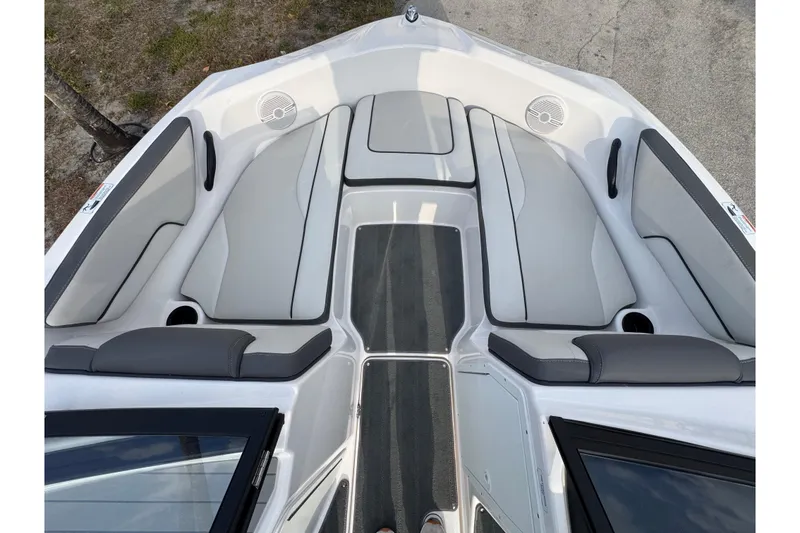 Slide: The Image of 2025 Yamaha Boats SX190 interior with gray seating and sleek design. - 10