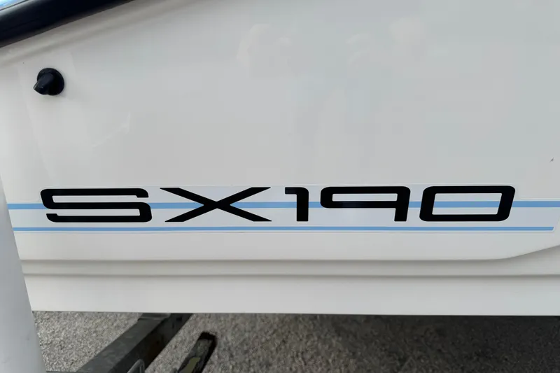 Slide: The Image of 2025 Yamaha Boats SX190 logo on white boat exterior. - 16