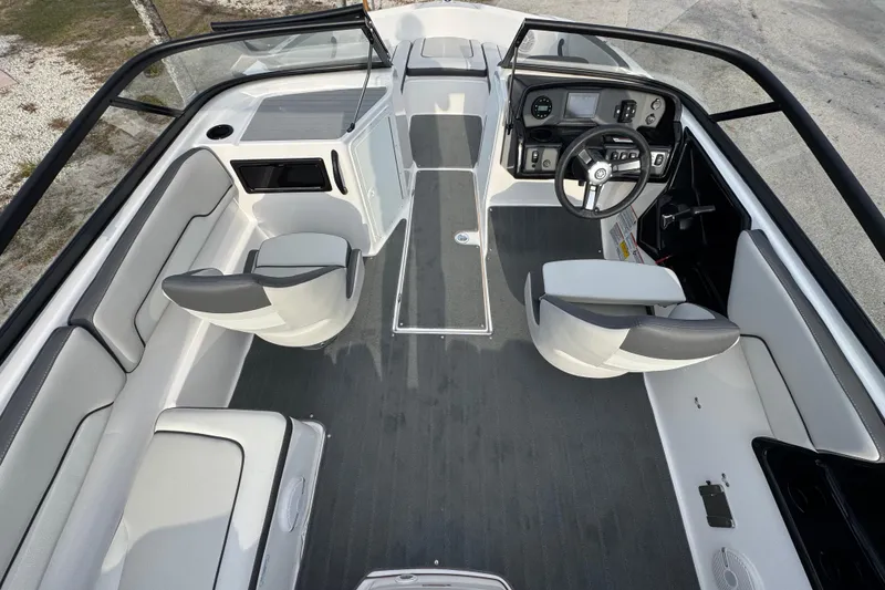 Slide: The Image of 2025 Yamaha Boats SX190 interior with modern dashboard and seating arrangement. - 5
