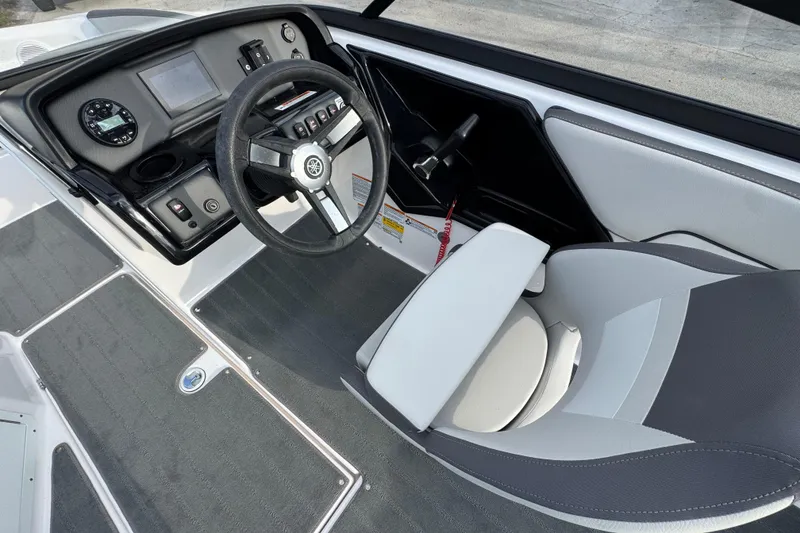 Slide: The Image of 2025 Yamaha Boats SX190 cockpit with steering wheel, dashboard, and seating. - 6