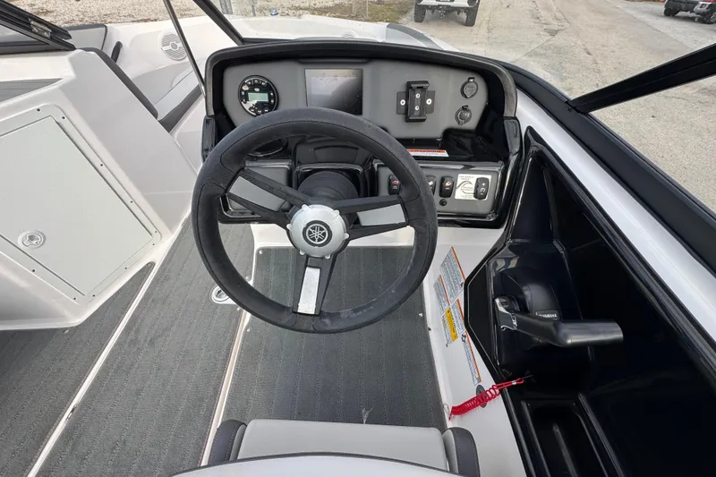 Slide: The Image of 2025 Yamaha Boats SX190 steering console with modern controls and dashboard. - 8