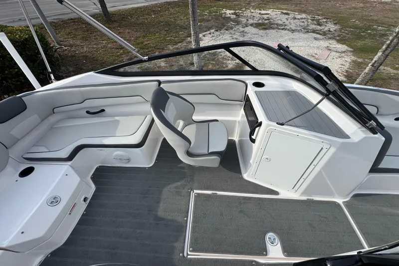 Slide: The Image of 2025 Yamaha Boats SX190 interior with sleek seating and modern dashboard design. - 9