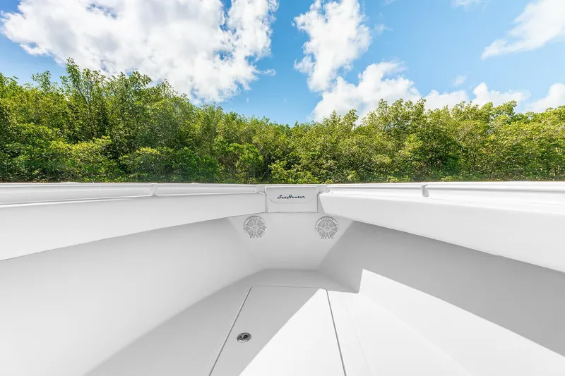 Slide: The Image of 2017 SeaHunter 35 Tournament boat interior with lush greenery and blue sky background. - 4